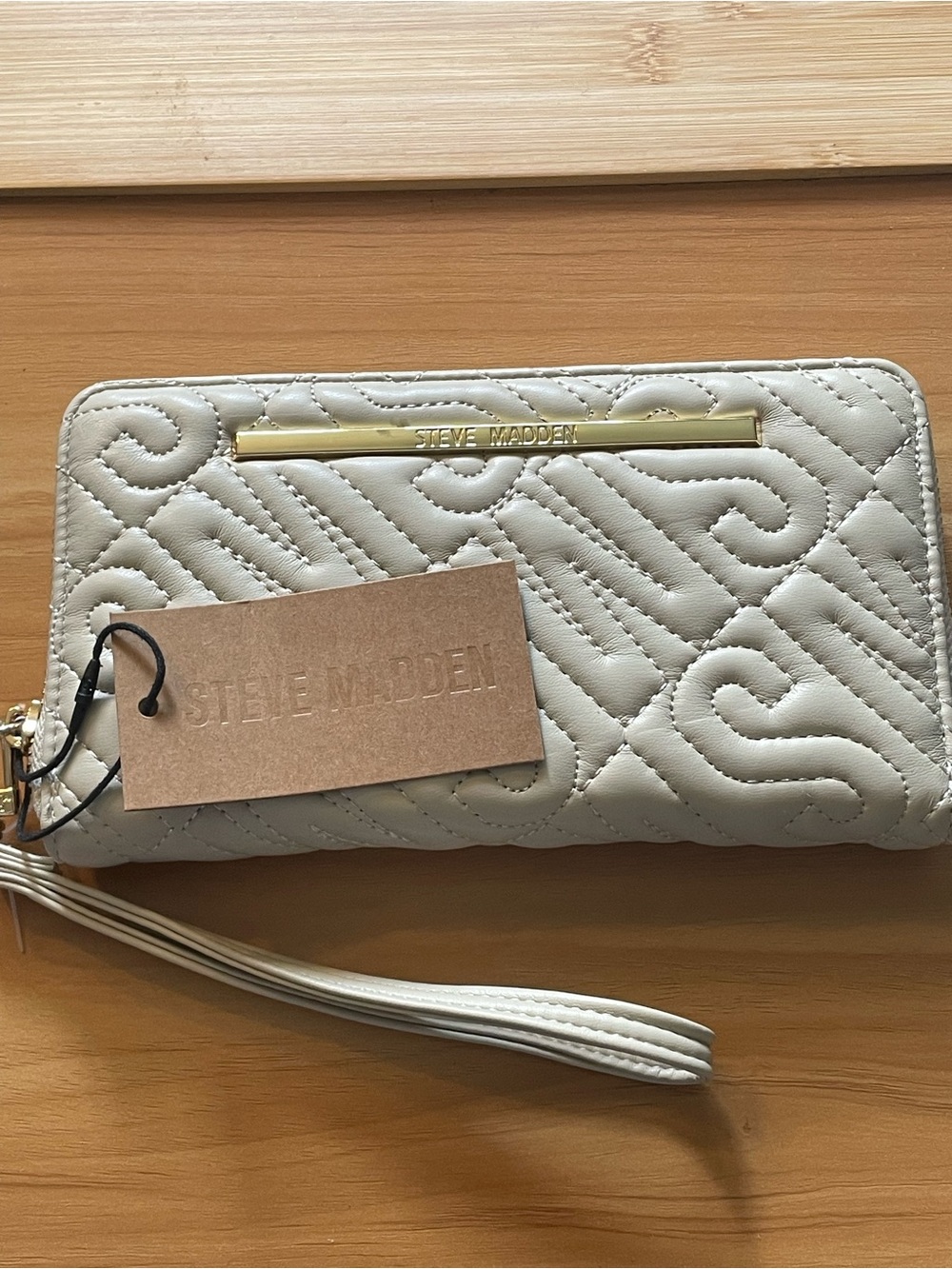Steve Madden Cream Quilted Wristlet with Gold Logo Bar